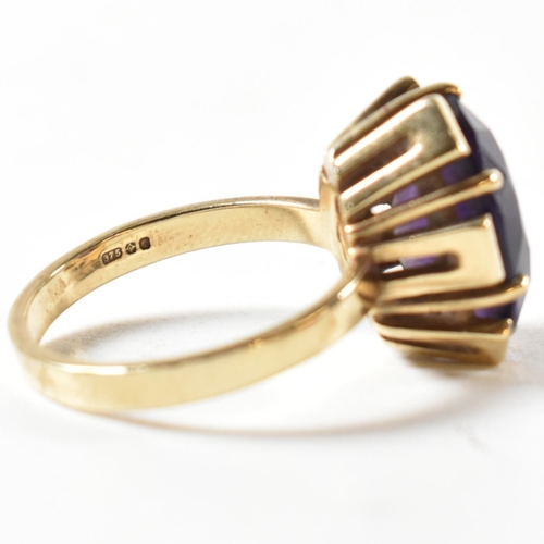 138 - A hallmarked 9ct gold and amethyst ring. The ring bearing import hallmark for London 1979. Weight 5g... 