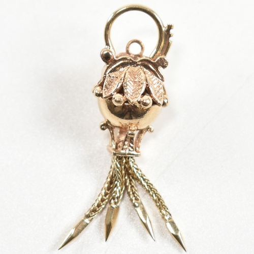 139 - A hallmarked 9ct gold antique style bauble clasp. The clasp having four tassels with spiked ends sur... 