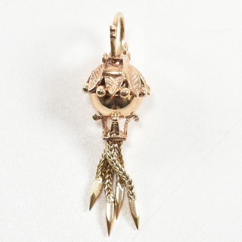 139 - A hallmarked 9ct gold antique style bauble clasp. The clasp having four tassels with spiked ends sur... 