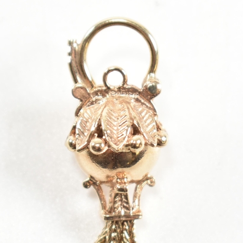 139 - A hallmarked 9ct gold antique style bauble clasp. The clasp having four tassels with spiked ends sur... 