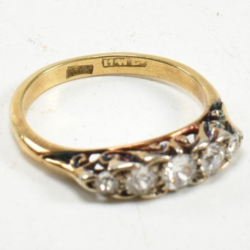 14 - An 18ct gold and diamond five stone ring. The ring set with five old cut diamonds to a scrolled gall... 