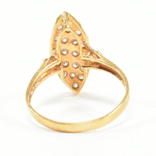 142 - A high carat gold and gem set ring. The ring set with white stones to a navette mount. Marked 835. T... 