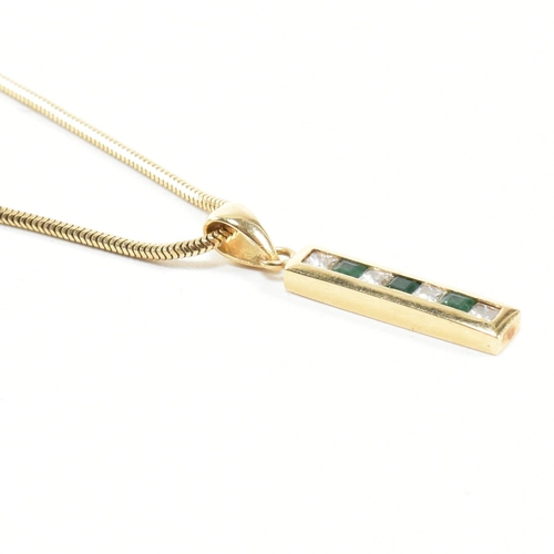 146 - An 18ct gold, emerald and diamond pendant necklace. The 18ct gold snake chain necklace strung with a... 