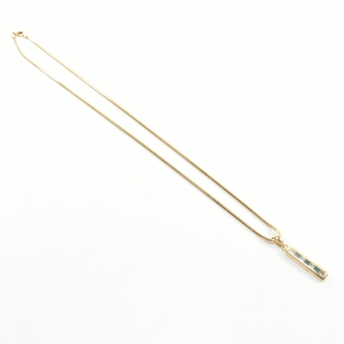 146 - An 18ct gold, emerald and diamond pendant necklace. The 18ct gold snake chain necklace strung with a... 