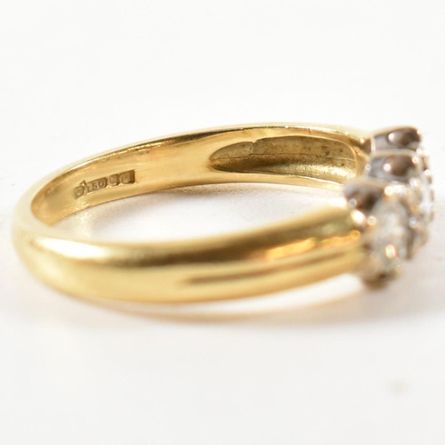 147 - A hallmarked 18ct gold and diamond trilogy ring. The ring three round cut diamonds set in a white go... 