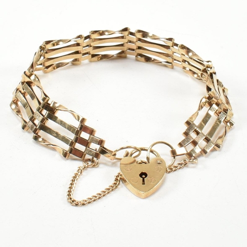 149 - A hallmarked 9ct gold gate link bracelet with a heart padlock clasp. The hallmarked gate link bracel... 