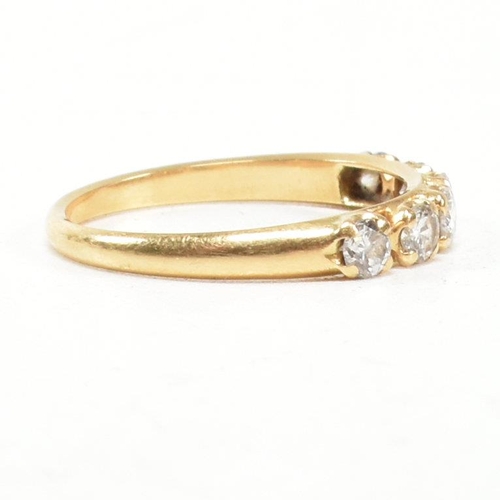 150 - A gold and diamond six stone ring. The ring set with six round brilliant cut diamonds. Estimated tot... 