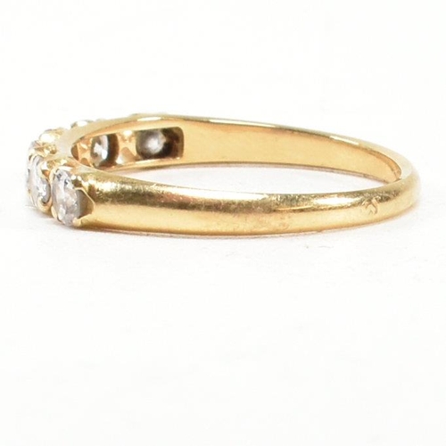 150 - A gold and diamond six stone ring. The ring set with six round brilliant cut diamonds. Estimated tot... 