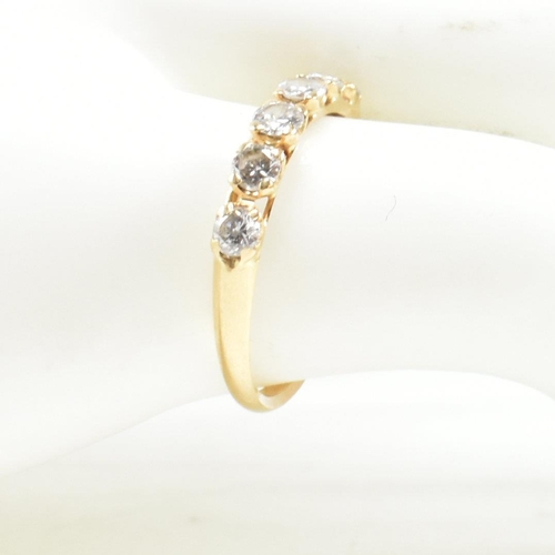 150 - A gold and diamond six stone ring. The ring set with six round brilliant cut diamonds. Estimated tot... 