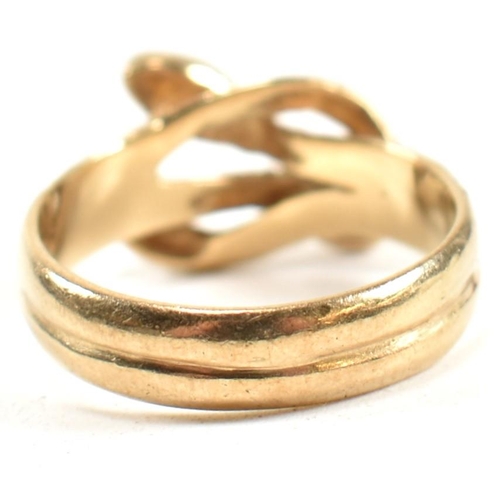 152 - A hallmarked 9ct gold entwined snake ring. The ring having a double entwined snake design with cross... 