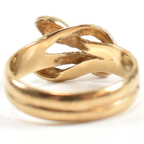 152 - A hallmarked 9ct gold entwined snake ring. The ring having a double entwined snake design with cross... 