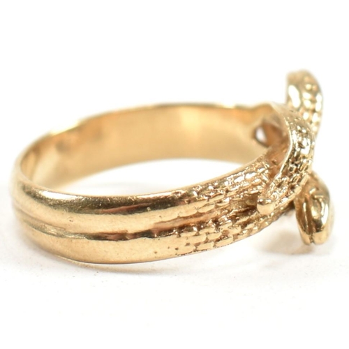 152 - A hallmarked 9ct gold entwined snake ring. The ring having a double entwined snake design with cross... 