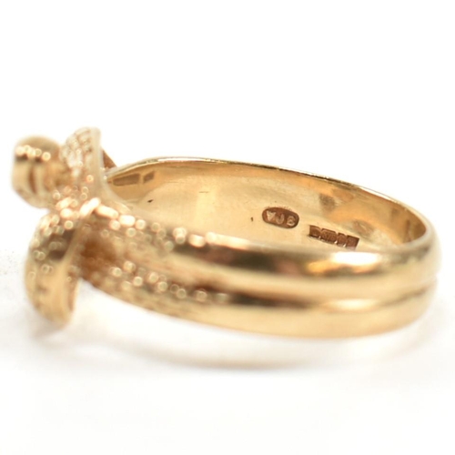 152 - A hallmarked 9ct gold entwined snake ring. The ring having a double entwined snake design with cross... 