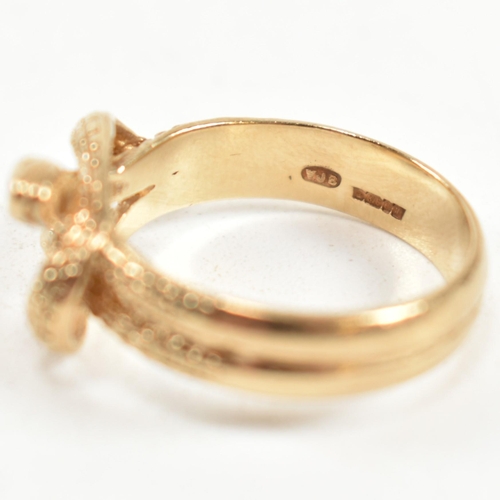 152 - A hallmarked 9ct gold entwined snake ring. The ring having a double entwined snake design with cross... 