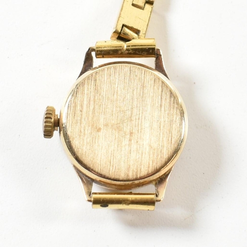 154 - A hallmarked 9ct gold omega watch on gilded Elgolux plated strap. The interior of the case hallmarke... 