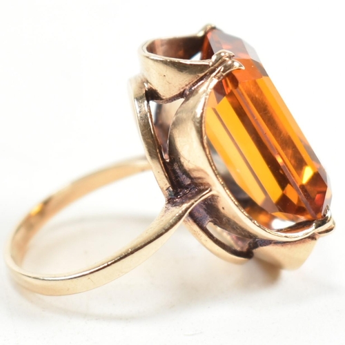 155 - A 1970s hallmarked 9ct gold and synthetic spinel cocktail ring. The ring having a single double claw... 