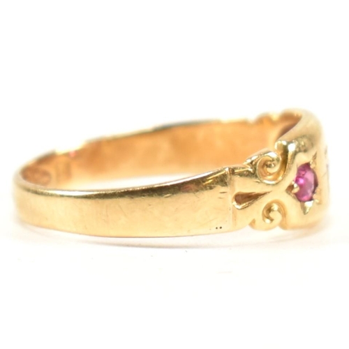 158 - A Victorian hallmarked 18ct gold, ruby and diamond dome ring. The three stone gypsy style ring havin... 