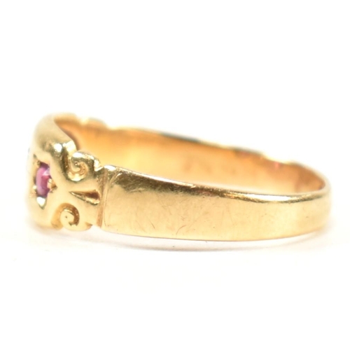 158 - A Victorian hallmarked 18ct gold, ruby and diamond dome ring. The three stone gypsy style ring havin... 