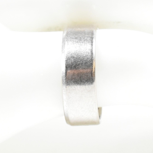 159 - A hallmarked 18ct white gold wide band ring. The ring hallmarked London. Weight 4.2g. Size J. All we... 