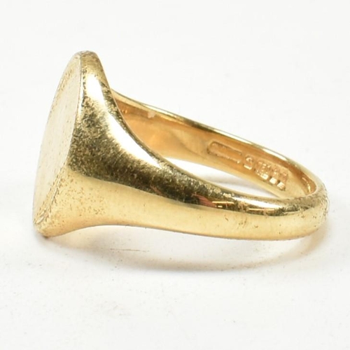 167 - A hallmarked 18ct gold signet ring. The signet ring having an oval vacant cartouche to tapering shan... 