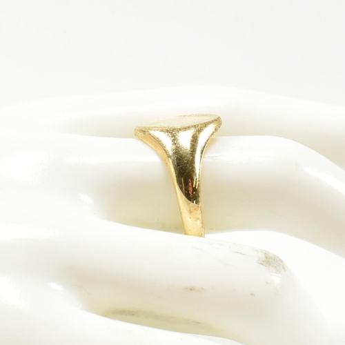 167 - A hallmarked 18ct gold signet ring. The signet ring having an oval vacant cartouche to tapering shan... 