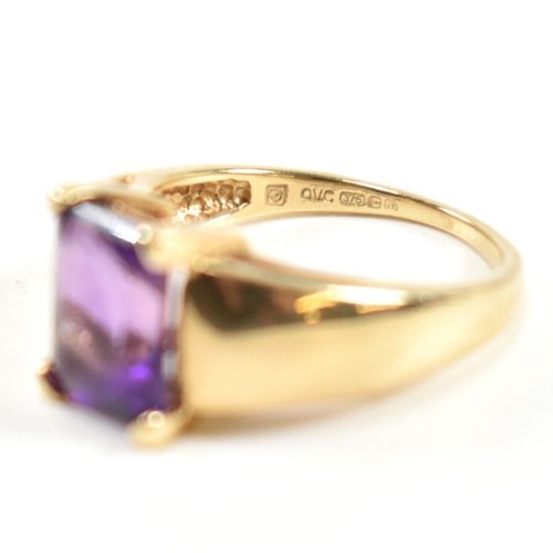 168 - A hallmarked 9ct gold and amethyst ring. The ring set with a central emerald cut amethyst in a domed... 