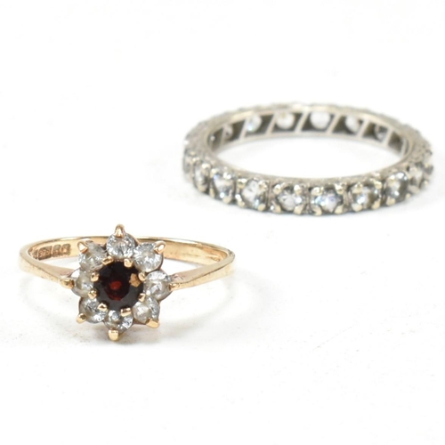 169 - Two 9ct gold and gem set rings. The rings to include a gem set white gold eternity ring stamped 9ct.... 