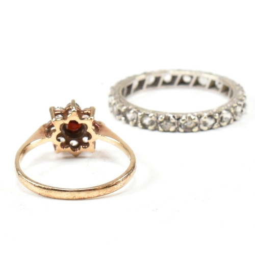 169 - Two 9ct gold and gem set rings. The rings to include a gem set white gold eternity ring stamped 9ct.... 