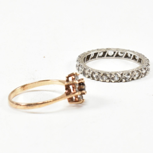 169 - Two 9ct gold and gem set rings. The rings to include a gem set white gold eternity ring stamped 9ct.... 