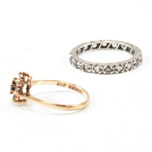 169 - Two 9ct gold and gem set rings. The rings to include a gem set white gold eternity ring stamped 9ct.... 