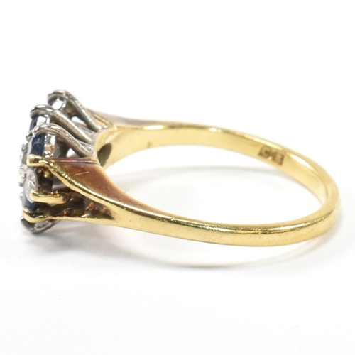 17 - A hallmarked 18ct gold, sapphire and diamond three layer ring. The ring set with two rows of three r... 