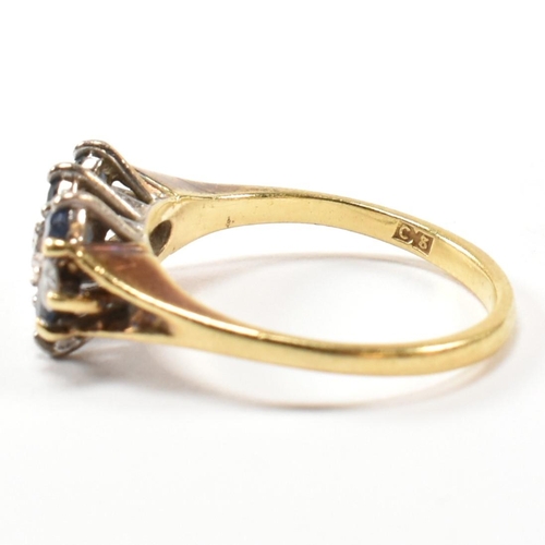 17 - A hallmarked 18ct gold, sapphire and diamond three layer ring. The ring set with two rows of three r... 