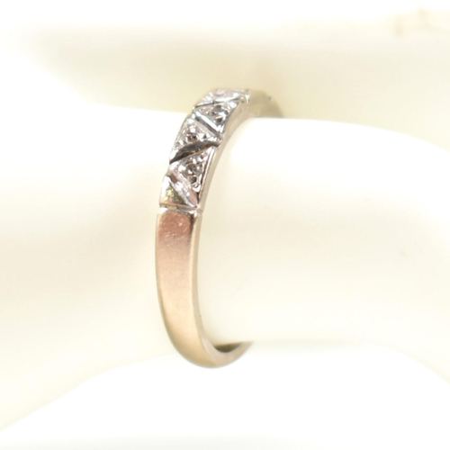 171 - A hallmarked 18ct white gold and diamond half eternity ring. The ring having a single row of nine il... 