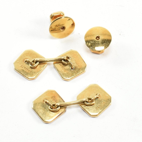 172 - A set of 18ct gold, platinum and enamel dress shirt studs and cufflinks. The set of gentleman's 18ct... 