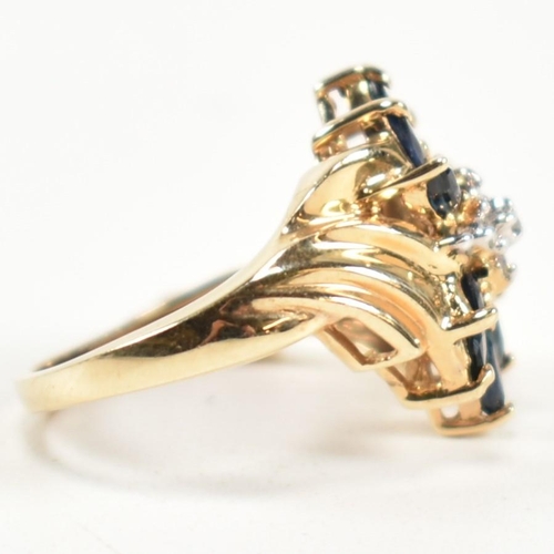 178 - A hallmarked 9ct gold, sapphire and diamond cluster ring. The ring having a central cluster of round... 