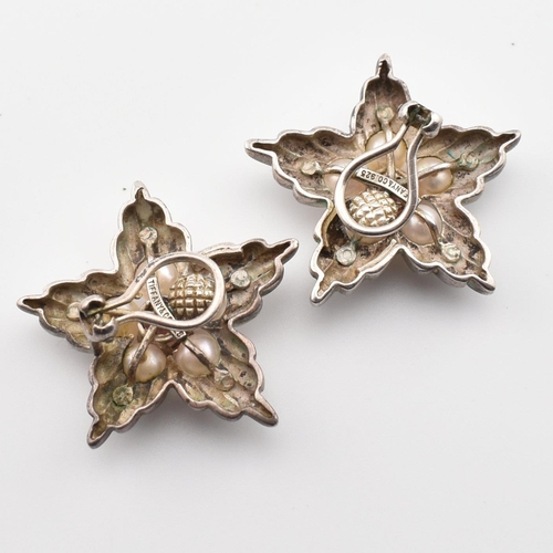 185 - A pair of Tiffany & Co silver, pearl and pink stone star ear clips. The Tiffany & Co clip-on earring... 