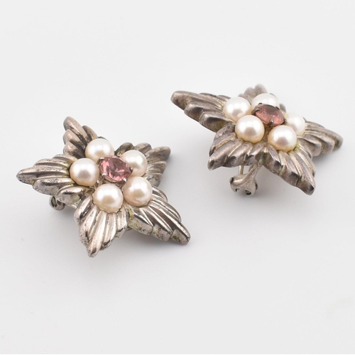 185 - A pair of Tiffany & Co silver, pearl and pink stone star ear clips. The Tiffany & Co clip-on earring... 