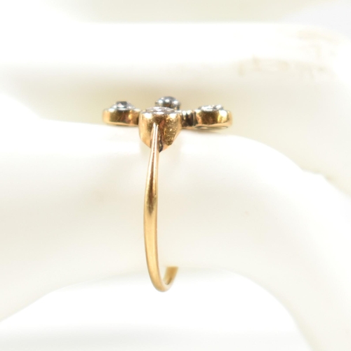 188 - An 18ct gold and diamond five stone ring. The ring having four bezel set round cut diamonds set in a... 