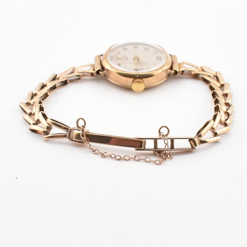 189 - A 9ct gold hallmarked ladies dress cocktail watch. Silvered dial with Arabic numbers. Set to a 9ct /... 