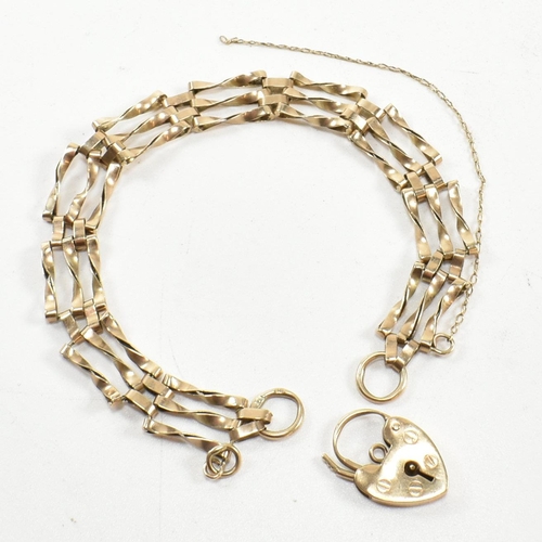 197 - A hallmarked 9ct gold twisted gate link bracelet with heart padlock clasp. The 9ct gold gate link br... 