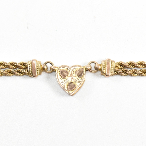 2 - A Victorian 9ct gold leontine watch chain. The leontine having a heart motif linked by rope twist ch... 