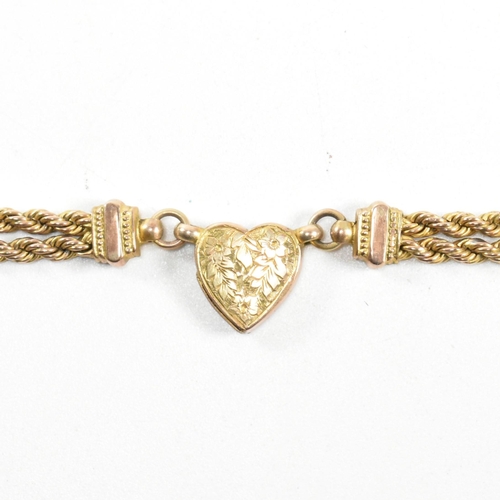 2 - A Victorian 9ct gold leontine watch chain. The leontine having a heart motif linked by rope twist ch... 