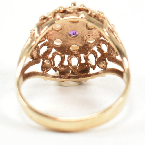 203 - A 1970s hallmarked 9ct gold, pearl and amethyst dome ring. The ring having a central round cut ameth... 