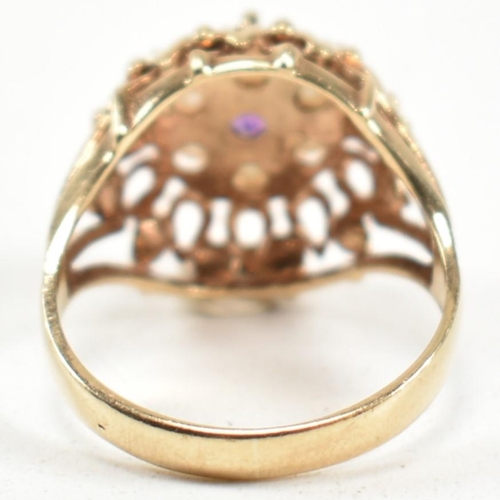 203 - A 1970s hallmarked 9ct gold, pearl and amethyst dome ring. The ring having a central round cut ameth... 