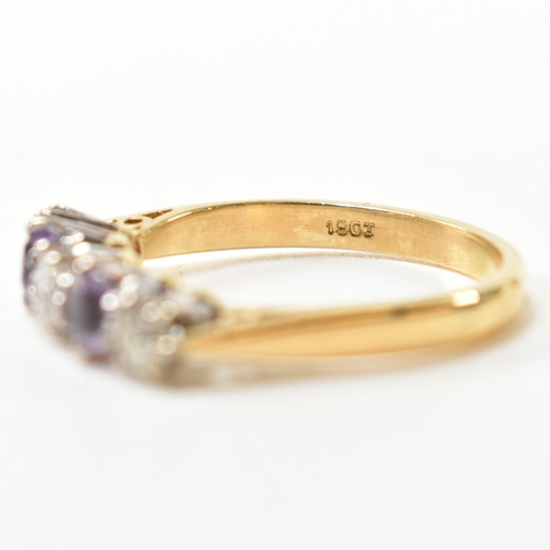 204 - An 18ct gold, amethyst and diamond five stone ring. The ring having three six claw set round cut dia... 