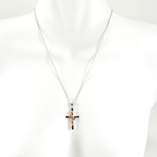 205 - A hallmarked silver and rose gold Clogau cross pendant necklace. The Clogau necklace having a sterli... 