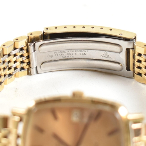 208 - An Omega Genève triple gold metal gentleman's wrist watch. The Omega Genève watching having gold lac... 