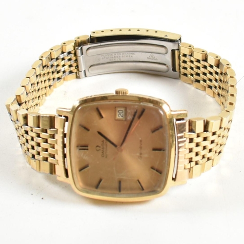 208 - An Omega Genève triple gold metal gentleman's wrist watch. The Omega Genève watching having gold lac... 