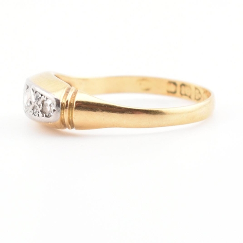 22 - A cased hallmarked 18ct gold and diamond ring. The ring set with three graduating round cut diamonds... 