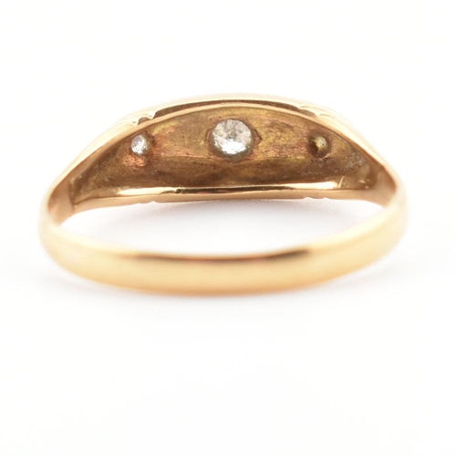 22 - A cased hallmarked 18ct gold and diamond ring. The ring set with three graduating round cut diamonds... 